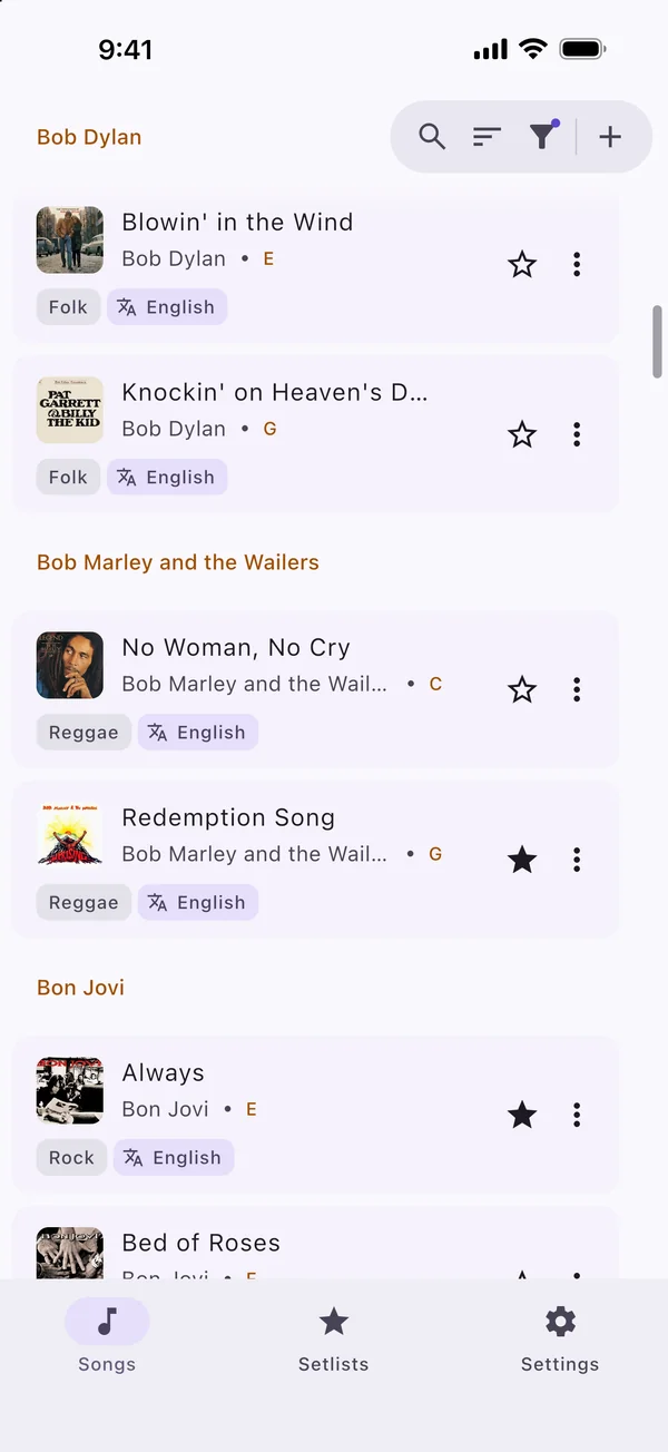 The song list, grouped by artist, with its tags under every song.