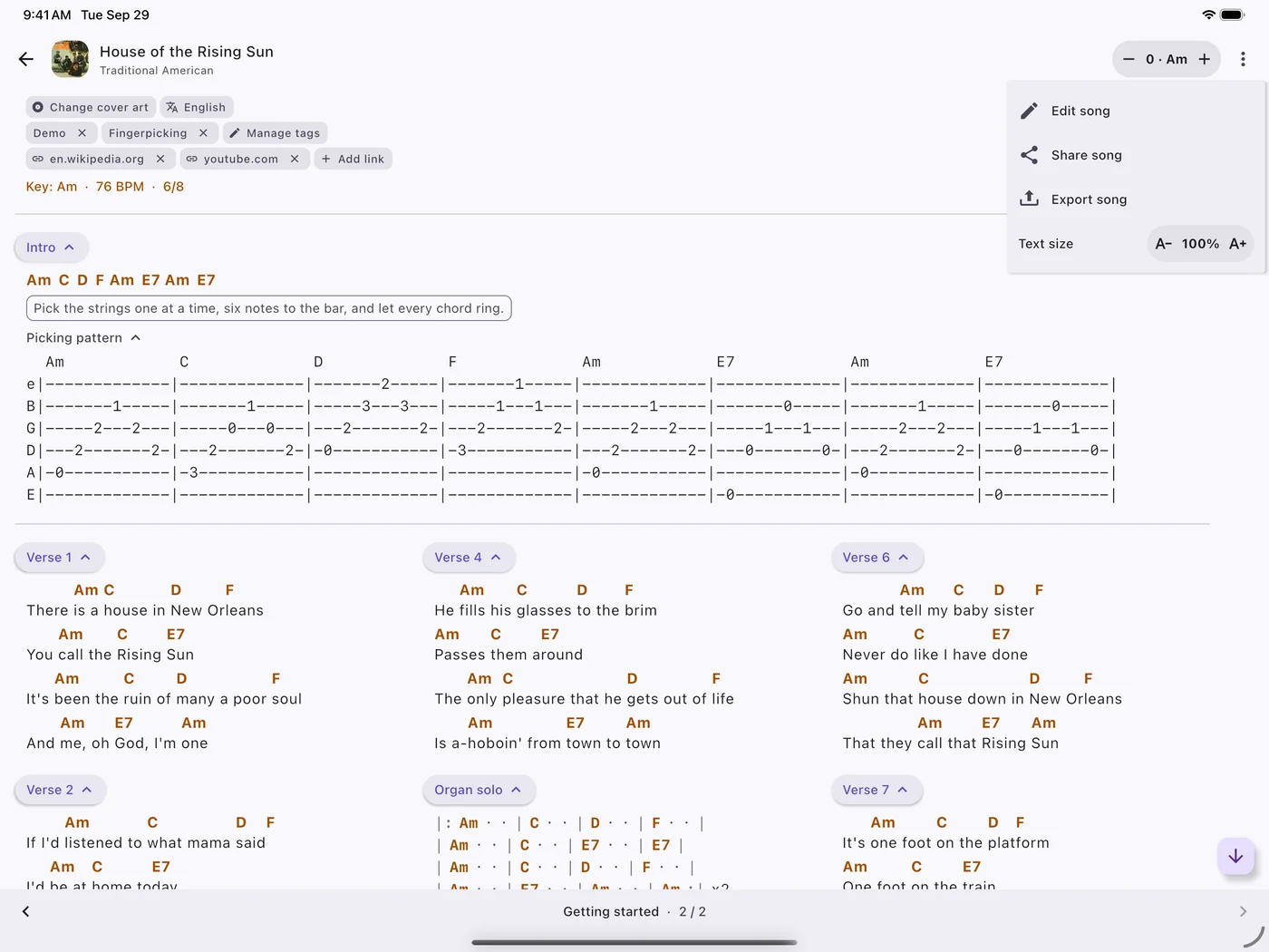 A song with its picking pattern and verses in columns, on an iPad.